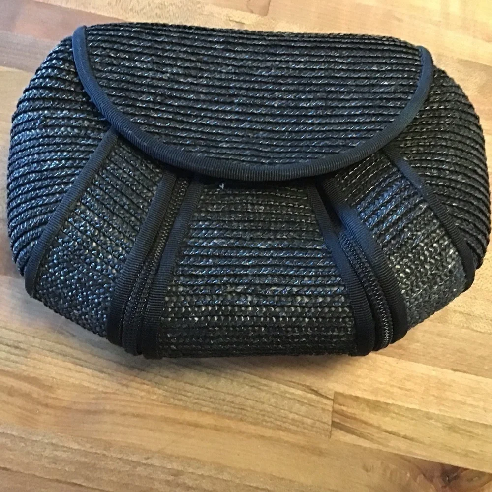 Magid woven grass black clutch and one no brand floral print wallet.